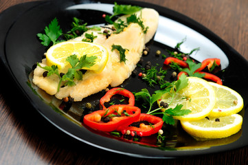 Black plate with fish meat