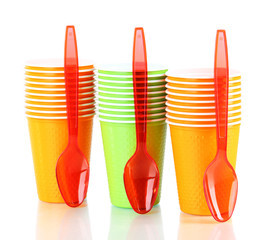 Cups and spoons in different color isolated on white