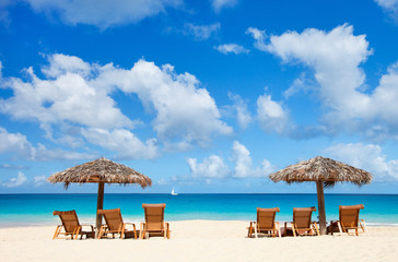 Chairs and umbrellas on tropical beach