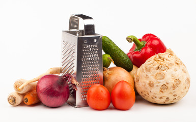 vegetables and grater isolated on white