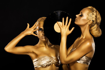 Women holding Vinyl Record. Fantastic Gold Badyart. Performance