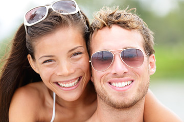 Happy young beach couple closeup portrait