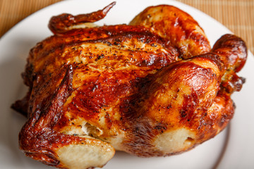 Whole Roast Chicken on White Plate