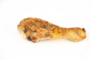 Roasted chicken leg on the white plate
