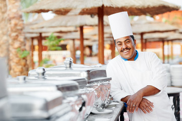 arab chef with food at restaurant hotel