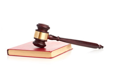 Judge's gavel on red legal book