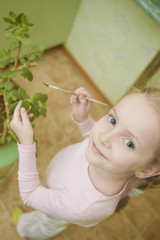 portrait of little girl doing cleaning