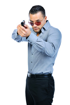 Handsome man with gun elegant spy