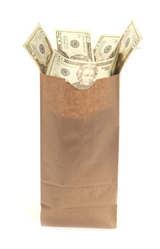 Brown paper bag with United States twenty dollar bills