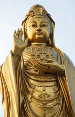 Fototapeta premium South Beach GuanYin 33 meters bronze plated statue at Zizhulin
