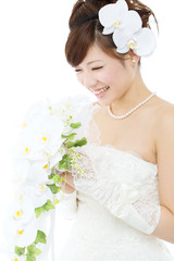 Beautiful asian woman dressed as a bride on white background