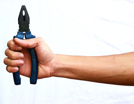 The strong hand hold the blue pliers