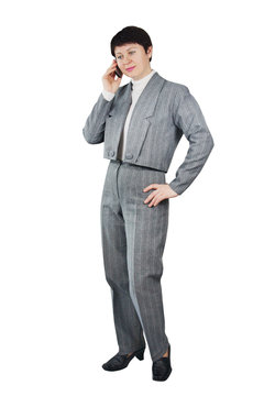 Business Woman Dressed In Gray Suit Talks By Mobile