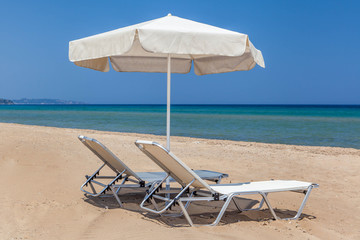 sun beds and sun umbrella on the beach