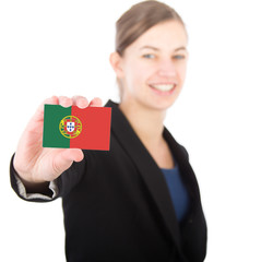 business woman holding a card with the Portuguese flag