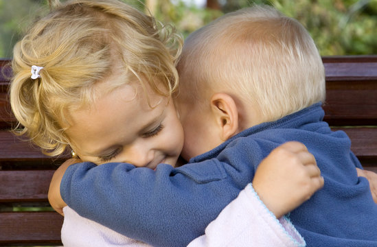 Happy Adorable Kids Hugging Each Other