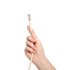 isolated woman hand holding a computer cable