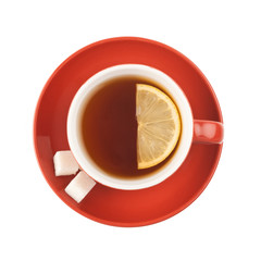 Red teacup with sugar and lemon.