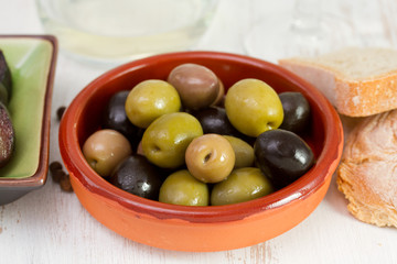 olives in the brown bowl