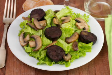 salad with portobello and sausages