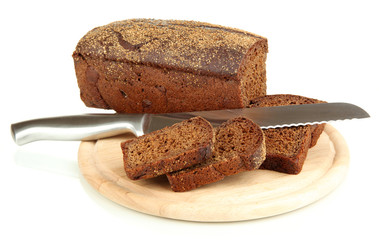 Sliced black bread and knife on wooden board isolated on white