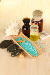 Sea spa elements on wooden table close up