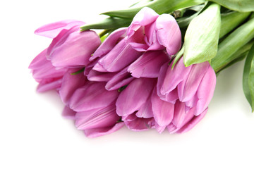 Obraz na płótnie Canvas Beautiful bouquet of purple tulips, isolated on white