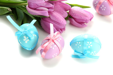 Bright easter eggs and tulips, isolated on white