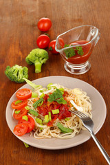 Tasty spaghetti with sauce and vegetables
