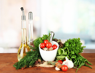 Composition of mortar, bottles with olive oil and vinegar, and