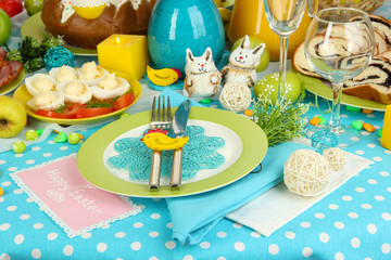 Serving Easter table with tasty dishes close-up