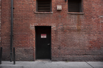 Alley Entrance backside of Brick Building
