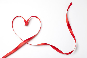 Red ribbon in heart shape