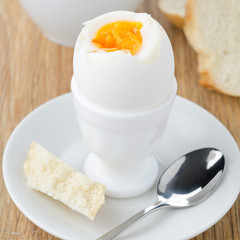 boiled eggs, bread and coffee for breakfast