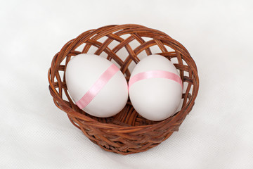 Easter eggs and basket isolated white