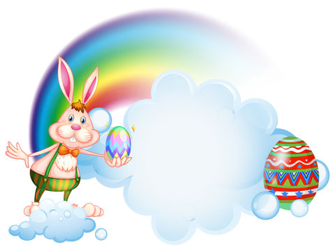 A bunny holding an egg near the rainbow