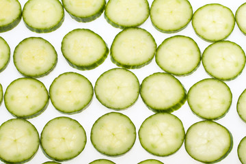 Freshly sliced cucumber  isolated on white background