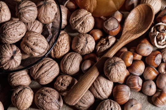 nuts, honey and wooden spoon