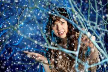 Beauty woman in winter forest