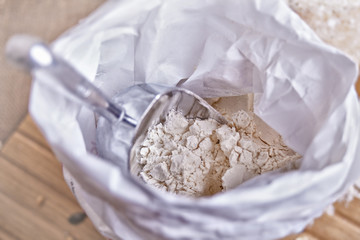 Fototapeta na wymiar bag of flour with scoop