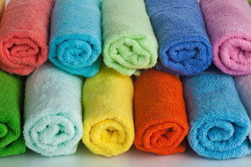 Obraz na płótnie Canvas Set of colored towels on white.