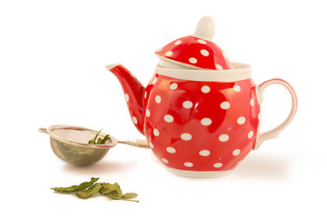 red kettle and tea leaves