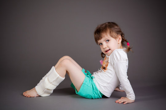 little girl on gray background