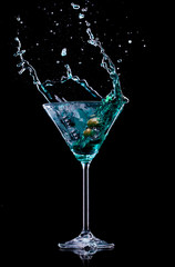 Martini drink over dark background