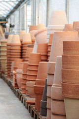 Piles of terracotta's pots in the store