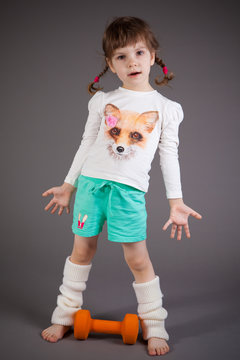 little girl on gray background