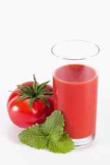 The glass of tomato juice with parsley