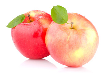 Two juicy Red apples with leaves and drops of water isolated on