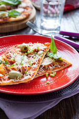 thin slices of pizza on a plate