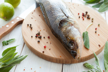 raw zander and spices on a cutting board, fish